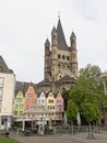 Tower of Great Saint martin church and facades of mdieval houses in Cologne. Royalty Free Stock Photo