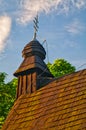 The tower of Greek Catholic wooden Church of the relics of St. Nicholas the Bishop in Ruska Bystra Royalty Free Stock Photo