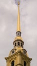 Tower high golden spire and clock Royalty Free Stock Photo