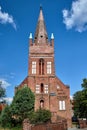 The tower of the historic, Gothic red brick church in the city of Skwierzyna Royalty Free Stock Photo