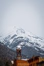 Tower of historic old City Hall in Silverton Colorado in the San Juan Mountains of Colorado CA USA with snowy mountains in the Royalty Free Stock Photo