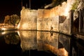 Tower and illuminated wall reflected in the water Royalty Free Stock Photo