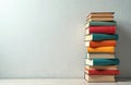 Tower of Knowledge Stack of colorful hardback books against minimalist background learning, cognitive growth. Represents Royalty Free Stock Photo