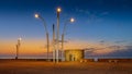 The tower of La Mata at Torrevieja in the early morning lit by lanterns.