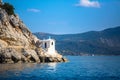 Tower lighthouse on the cliffs in the Aegean sea