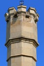 Tower from limestone blocks with lamp on top Royalty Free Stock Photo