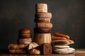 tower of loaves, stacked high with a variety of breads and shapes