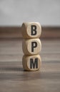 Tower made of cubes and dice with acronym BPM Business Process Management