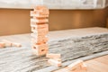 A tower made of Jenga wooden blocks, an arcade social game