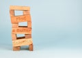 A tower made of wooden blocks with the slogan \