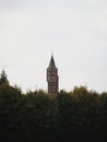Tower of medieval archers guild Koninklijke Hoofdgilde Sint Sebastiaan schuttersgilde between trees in Bruges Belgium