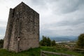 Tower of the medieval castle of Solimbergo with a dramatic view of the city centre of Sequals Royalty Free Stock Photo