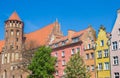 Tower of the Mikolaja church and colorful houses in Gdansk Royalty Free Stock Photo