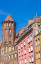 Tower of the Mikolaja church and colorful houses in Gdansk Royalty Free Stock Photo