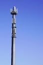 Tower for mobile operator phone relay antenna on blue background sky Royalty Free Stock Photo