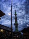 The tower of a mosque on a cloudy afternoon Royalty Free Stock Photo
