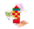 Tower from multi-coloured cubes and banknotes Royalty Free Stock Photo