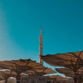 A tower of nabawi mosque with the umbrella open Royalty Free Stock Photo