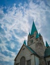 Tower of old Cathedral building in Wroclaw City with beautiful cloudy sky as background Royalty Free Stock Photo