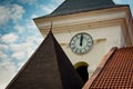 Tower old clock on background of blue sky with clouds Royalty Free Stock Photo