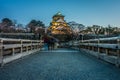 Tower of Osaka Japanese Castle and Gokurakubashi Bridge with tourists Royalty Free Stock Photo