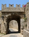 Tower and a part of the fortress wall with a gate, medieval fortress, the old town of Rhodes, Greece