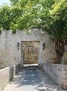 Tower and a part of the fortress wall with a gate, medieval fortress, the old town of Rhodes, Greece