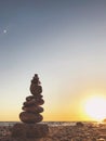 Tower of pebble in the Kabak Valley beach and sunset Royalty Free Stock Photo