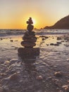 Tower of pebble in the Kabak Valley beach and sunset Royalty Free Stock Photo