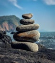 Tower of pebbles alongside beach