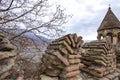 Tower and protective wall of the fortified Ananuri castle on the background of the Zhinvali reservoir Royalty Free Stock Photo