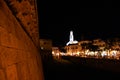 Tower of the provincial administration building seen at night with lights reflections in the Adriatic sea from the medieval castle