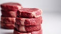 Tower of Raw Beef Steaks: Perfectly Captured on White Background