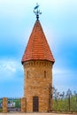 Tower with red pointed roof and weather vane Royalty Free Stock Photo