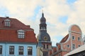 Tower of the Riga Dome Cathedral, view through the houses of the old city, Latvia Royalty Free Stock Photo