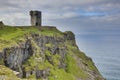 Tower ruin over steeply cliffs at Irish West coast