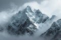 Tower of snow covered peaks majestically reaches for the cloudy heavens