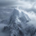 Tower of snow covered peaks majestically reaches for the cloudy heavens Royalty Free Stock Photo