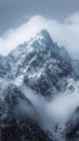 Tower of snow covered peaks majestically reaches for the cloudy heavens