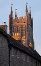 Tower of St Andrew`s Church rises above local houses in the historic village of Mells in rural Somerset, UK