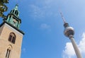 The tower of St Mary\'s Church Marienkirche and the TV Tower Fernsehturm Berlin Germany.