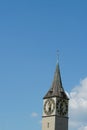 The tower of St. Peters Church in Zurich, Switzerland with big clock and a flag of Zurich on the top. Royalty Free Stock Photo