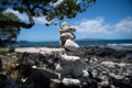 Tower of stones on sea beach background. Relaxing in the tropical beach, with stack of stones. Royalty Free Stock Photo