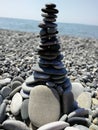 The tower stones at the shingle beach sea background