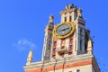 Tower with thermometer of Lomonosov Moscow State University MSU in sunny summer evening against blue sky Royalty Free Stock Photo