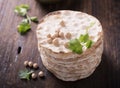 Tower thin crispy loaves of useful home cakes with chick-pea flour for vegetarinskogo and healthy eating. On a dark Royalty Free Stock Photo