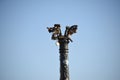 Tower top in Place de la Bastille with a clear blue sky in the background in Paris, France