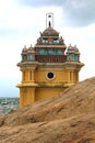 Tower top with sky and city houses in the trichirappalli rockfort vinayagar temple.