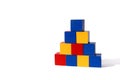 Children`s toy. Bright multi-colored cubes are stacked in a pyramid. Royalty Free Stock Photo