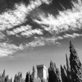 Tower trees and cloudy sky Royalty Free Stock Photo